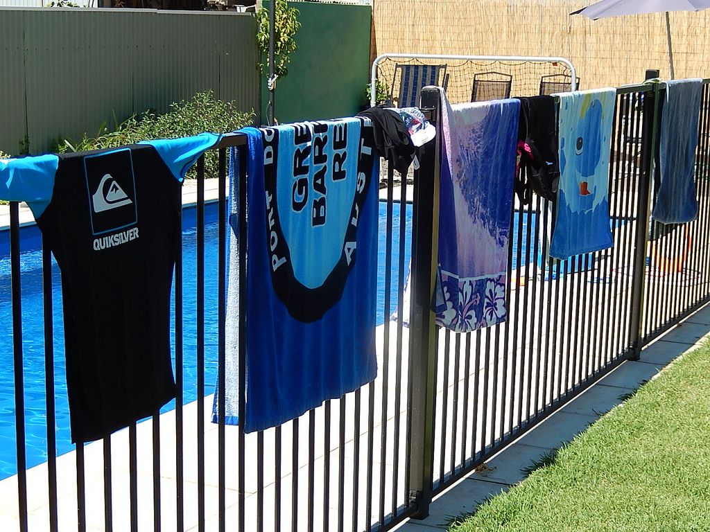 Pool fence with towels on it in Springfield Lakes